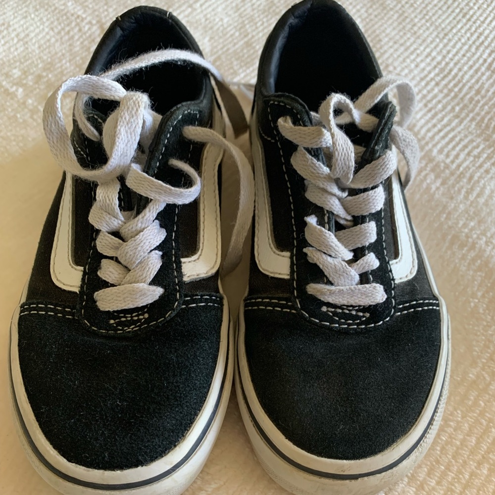 Black and white youth Vans.